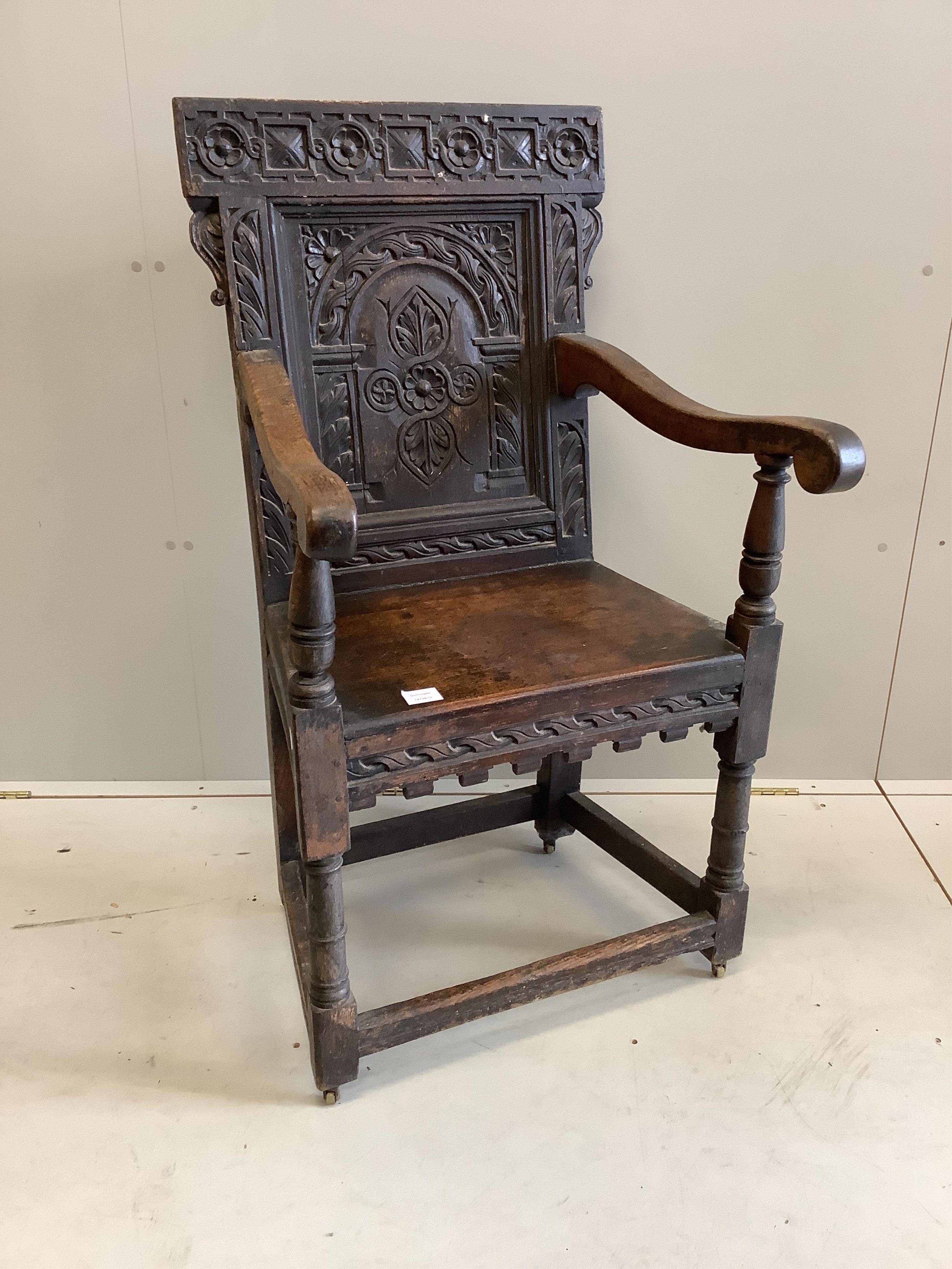 A 17th century oak wainscot type chair, width 61cm, depth 49cm, height 110cm. Condition - fair